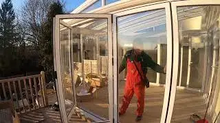 New conservatory with folding doors on a decking and concrete base!
