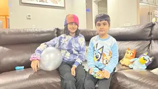 Toshani and Advit playing keepy uppy , the Bluey game. 