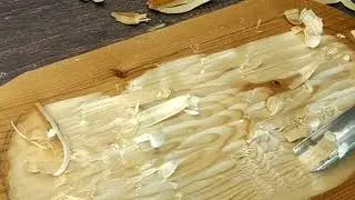 Carving a figure out of wood. Working with wood tools. ASMR