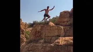 Small cliff jumping into rock pool