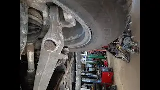 Tire with metal cords showing from impact damage and hitting the control arm on the inside