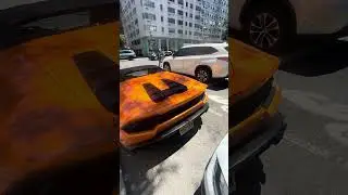 LAMBORGHINI PARKED IN THE MIDDLE OF A BUSY STREET ON THE UPPER EAST SIDE MANHATTAN NEW YORK CITY