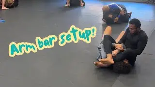 beginner white belt sets up first arm bar 