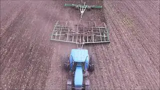 Ford 8970 with John Deere 726 Soil Finisher and Unverferth rolling harrow spring tillage