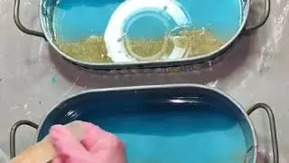 Pouring a resin beach scene in galvanized trays with teal beach water and white waves and sand shell