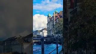 Reuss River and the Jesuit Church in Lucerne Switzerland