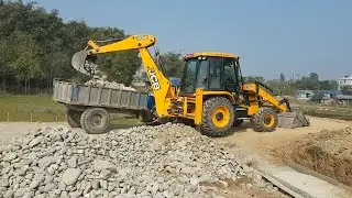 JCB Backhoe Loader Loading Stone in Tractor - JCB Machine At Work