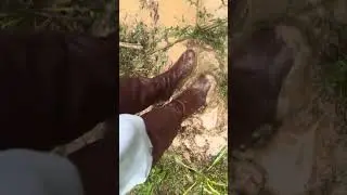 Brown chloe boots in muddy puddle