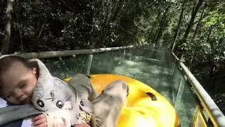 Arthur sleeping in the water slide through the forest in Fujian, China.