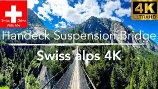 Switzerland suspension bridge with a waterfall view in 4k