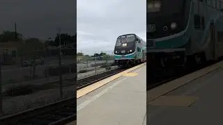 A Passenger-Train in CA USA is coming and parking at its station to let the passengers go out and in