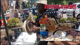 African girl inside African art craft market//Gladys lin