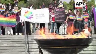Activists protest Russian law banning homosexual propaganda ahead of flame handover