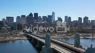 Aerial establishing city skyline of Boston Massachusetts with Longfellow bridge and subway train cro