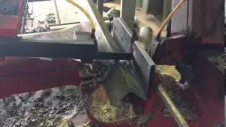 Bandsaw cutting through steel