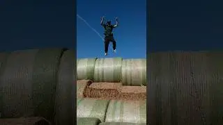 Jumping on a stack of hay and falling off