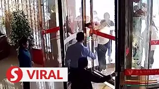 Baby stuck in hotel&rsquo;s revolving doors rescued in just three minutes