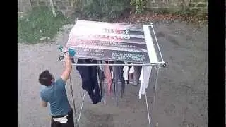 CLOTHESLINE AUTOMATIC RAIN PROTECTOR - Team HEI   (HitachiGST-WD EMERSON IMI)