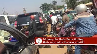 Ridding Through Crazy Traffic in Kampala