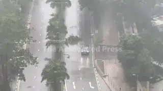 Strong winds and rain in Hong Kong as Tropical Storm Tapah passes nearby