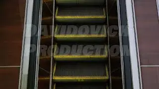 Empty going down escalator in Moscow metro, urban public transport infrastructure