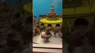 A zoetrope illusion: still objects creating motion through rotation.