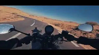 لمحبي المنعرجات، جولة بدراجة k-light 202 على طريق متعرج بين الجبال.