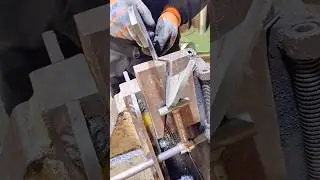 Precision Metal Cutting Process Using a Vise and Industrial Saw for Perfect Angled Edges