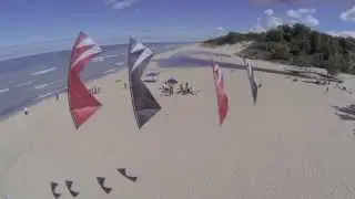 A quadcopter filming the 180GO! kite team flying Revolution quad line sport kites.