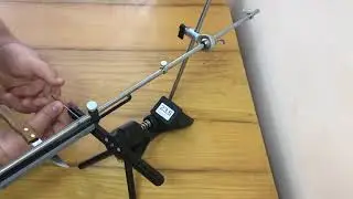 Angle-adjustable clamps for rotary sharpener