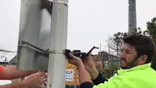 How to install a sign onto a lamp pole or utility pole