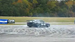 Tyler Nelson drifting on a damp course