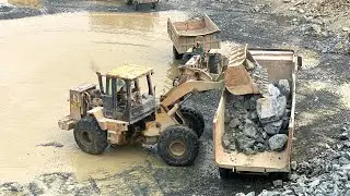 Heavy Machinery at Work: Mountain Rock Loading Operation