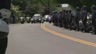 Hearse carrying Ofc. Amy Caprio arrives at Dulaney Valley Memorial gardens