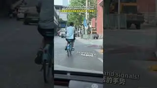 Cyclist Uses Hand Signals as 