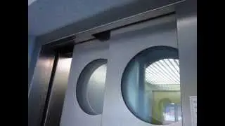 Osma traction glass elevator at a parking garage in Leer