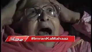 Old woman praying for IK