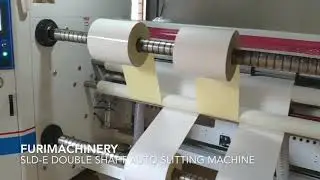SLD-E label stock paper slitting machine.  Slitter rewinder for non-woven mask fabric