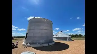 Building a grain bin by myself....kinda. Installing unload auger and sump in a new grain bin.