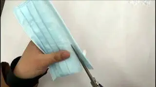 3 Ply/Layer surgical mask is cut open to reveal