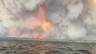 Hundreds of Wildfires Burn Across Canada Sending Smoke Into the US