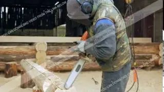 Man makes curly cutting wood Chainsaw. The log will be part of the future of the wooden house