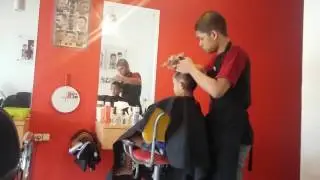 Tsaqif Barbershop's Capster in stylish with young boy