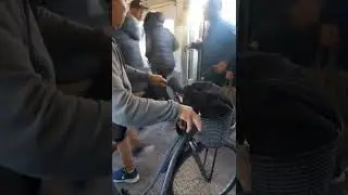Rush hour chaos: commuters boarding through train windows for seats
