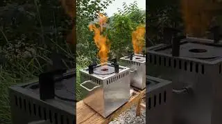 Double vapor stoves = outdoor group cooking wins (two steady flames on the grassy setup!)