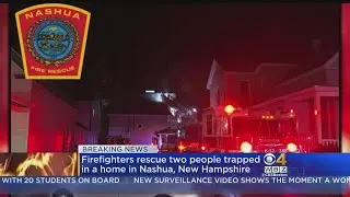 Firefighters Rescue 2 People Trapped In Fire