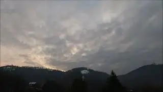 🌥️⏳ Timelapse Wonder: Clouds Dancing Over the Rolling Hills 🏞️📽️