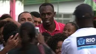 Usain Bolt tours Rio favela sports area
