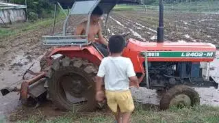2402 kubota tractor in rice field