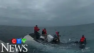 Caught on cam: Boaters rescued after their boat capsizes
